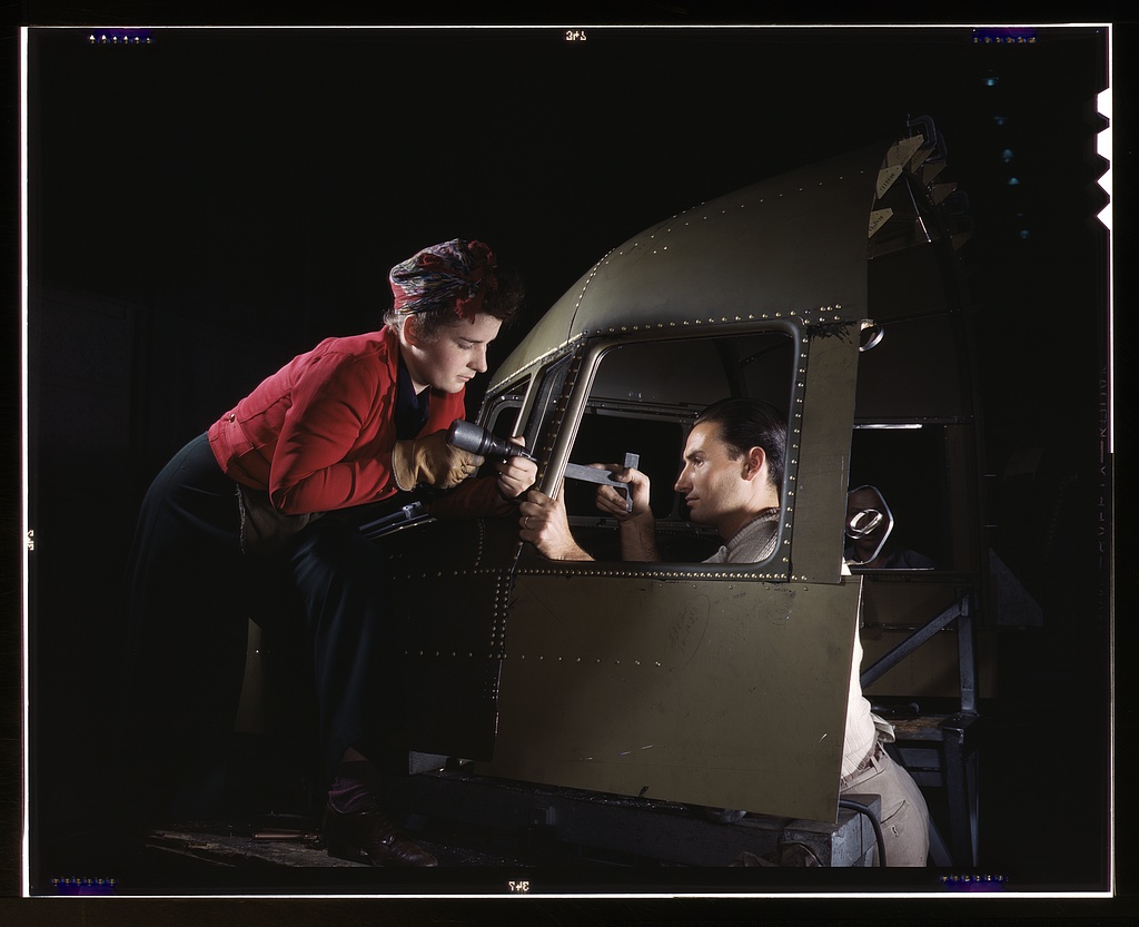 Riveting team working on the cockpit shell of a C-47, Long Beach Factory